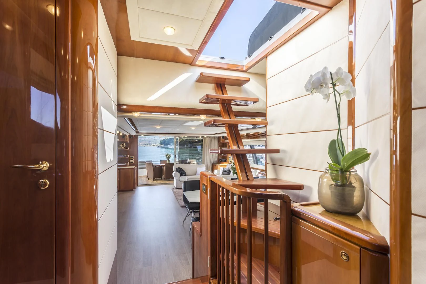 a room with wood furniture and a wood door aboard MISS KATARIINA Yacht for Sale