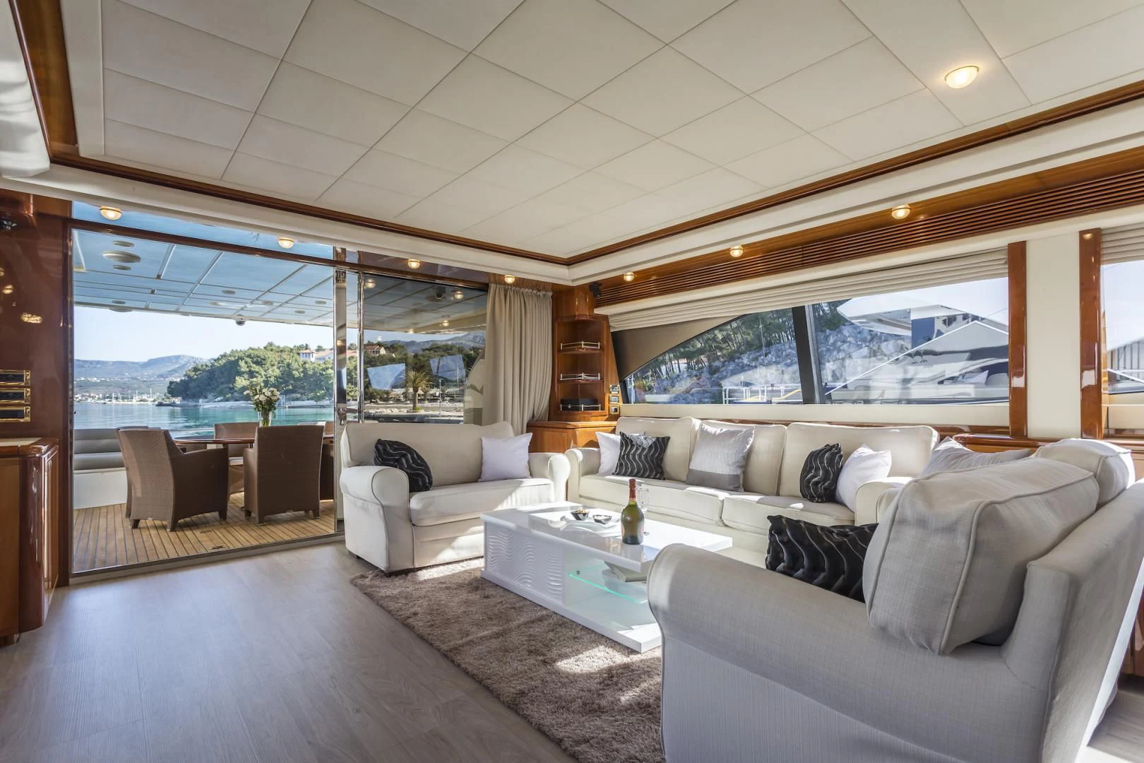 a living room with a large window aboard MISS KATARIINA Yacht for Sale