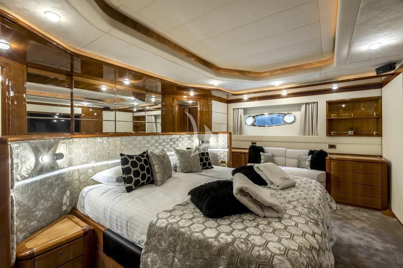 a bed with a white bed spread aboard MISS KATARIINA Yacht for Sale