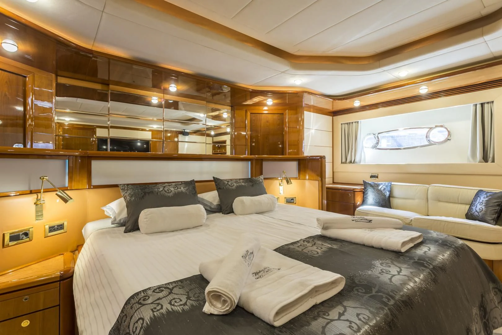 a bed with pillows and pillows aboard MISS KATARIINA Yacht for Sale