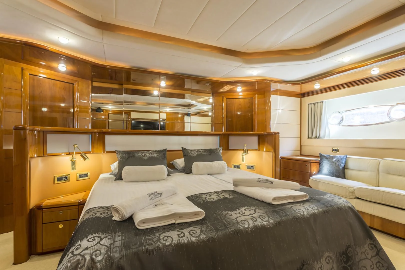 a room with a bed and a couch aboard MISS KATARIINA Yacht for Sale