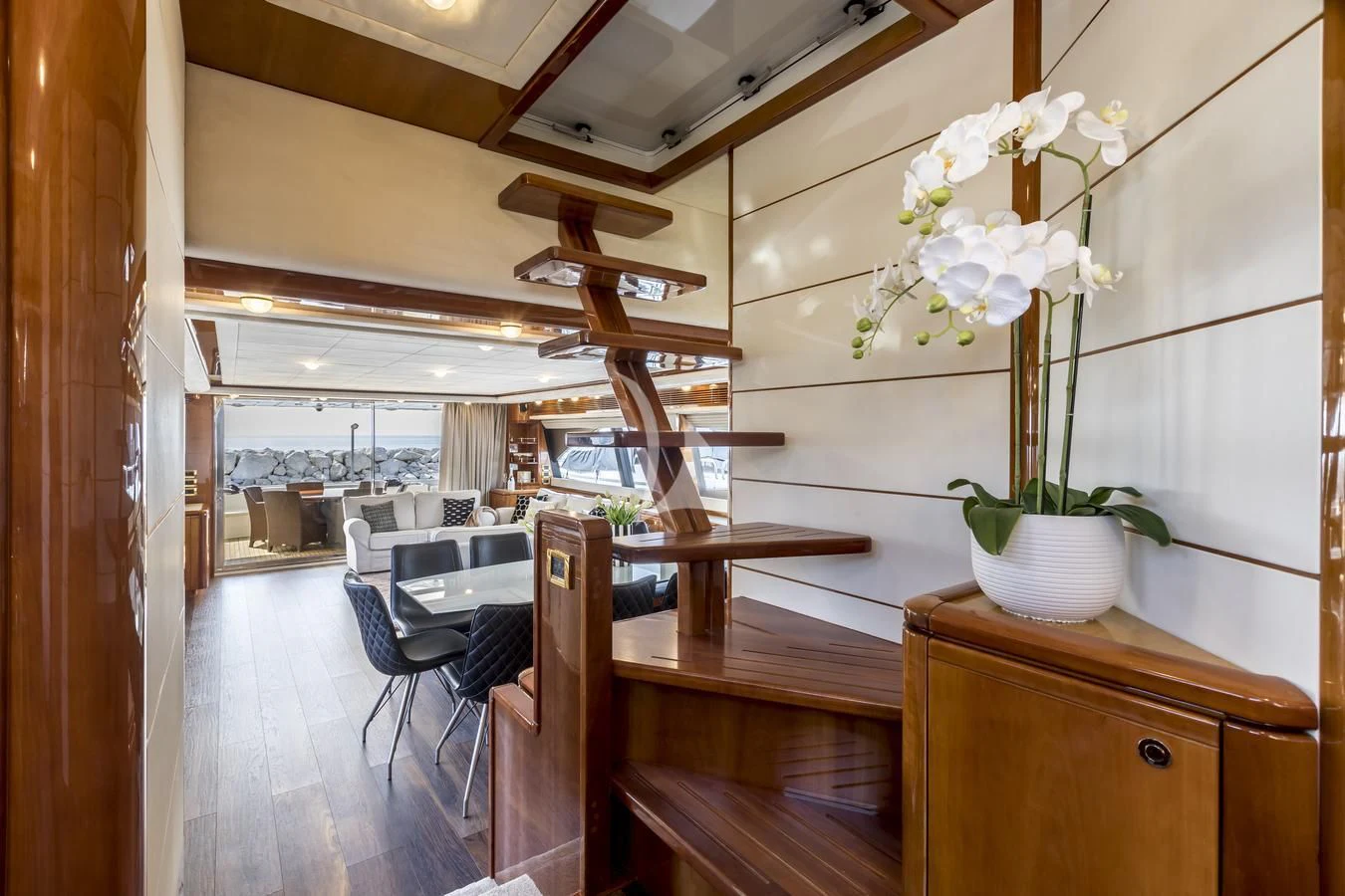a room with a table and chairs aboard MISS KATARIINA Yacht for Sale