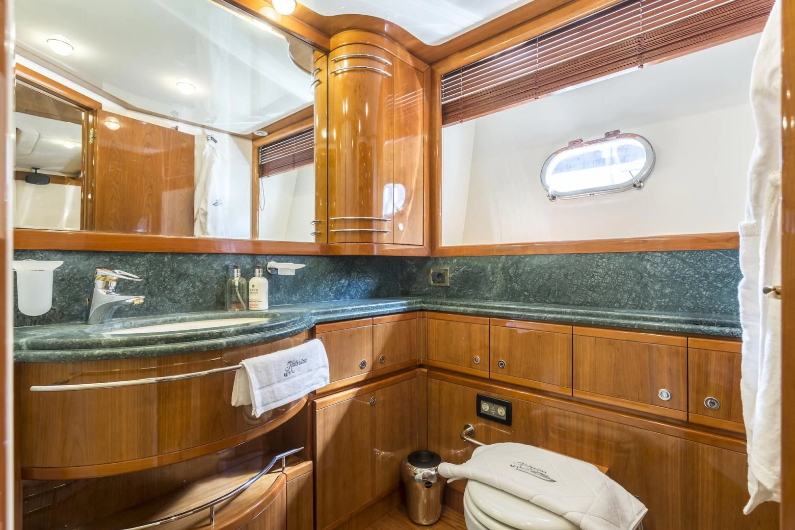 a bathroom with a sink and a toilet aboard MISS KATARIINA Yacht for Sale