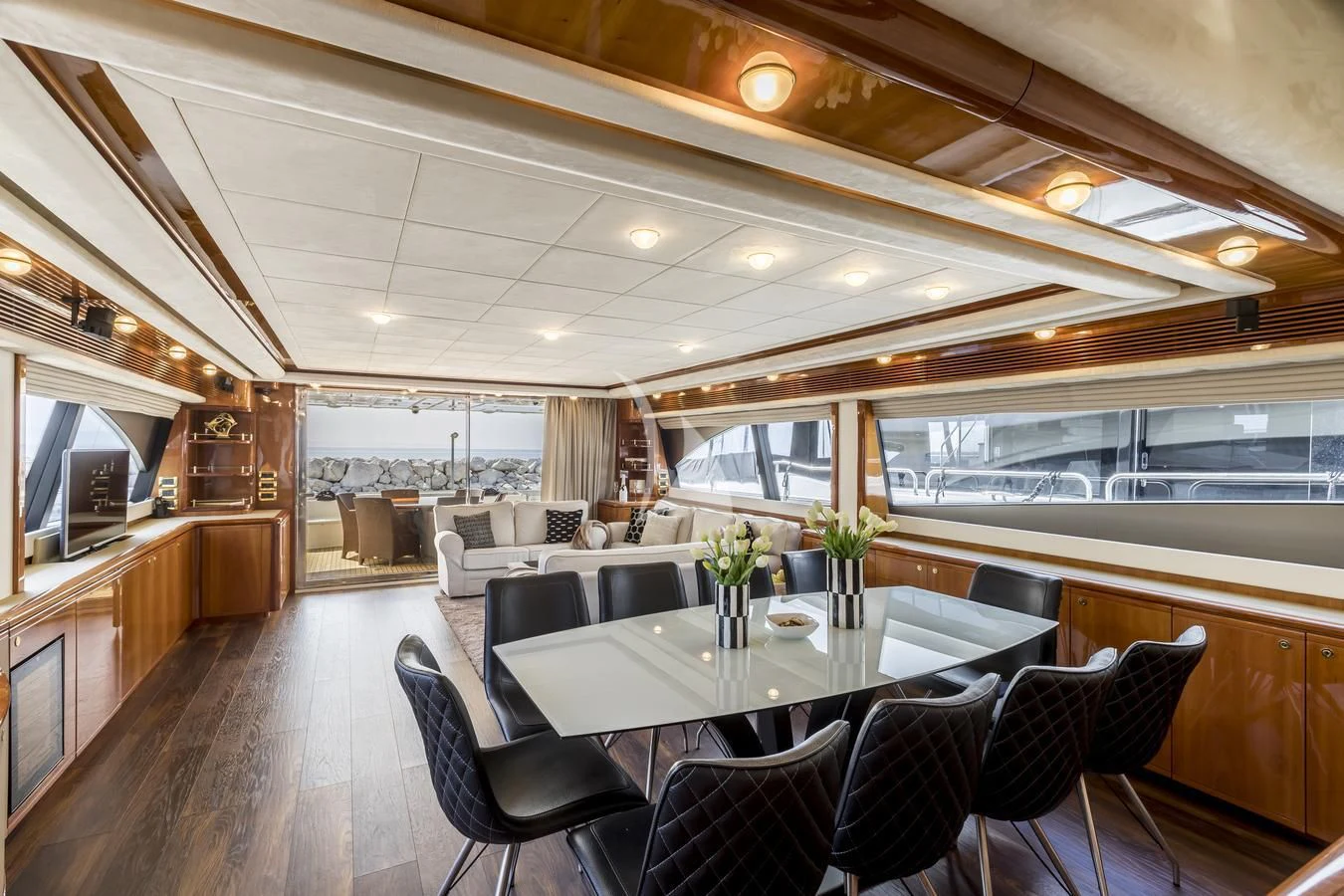 a large room with a table and chairs aboard MISS KATARIINA Yacht for Sale