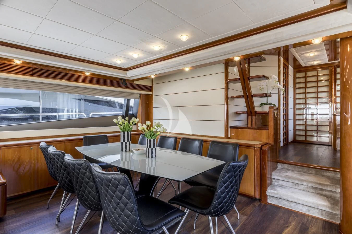 a room with a table and chairs aboard MISS KATARIINA Yacht for Sale