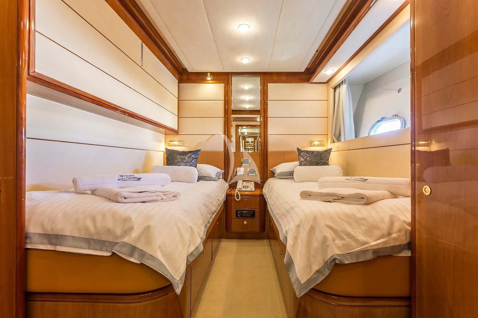 a room with beds and a mirror aboard MISS KATARIINA Yacht for Sale