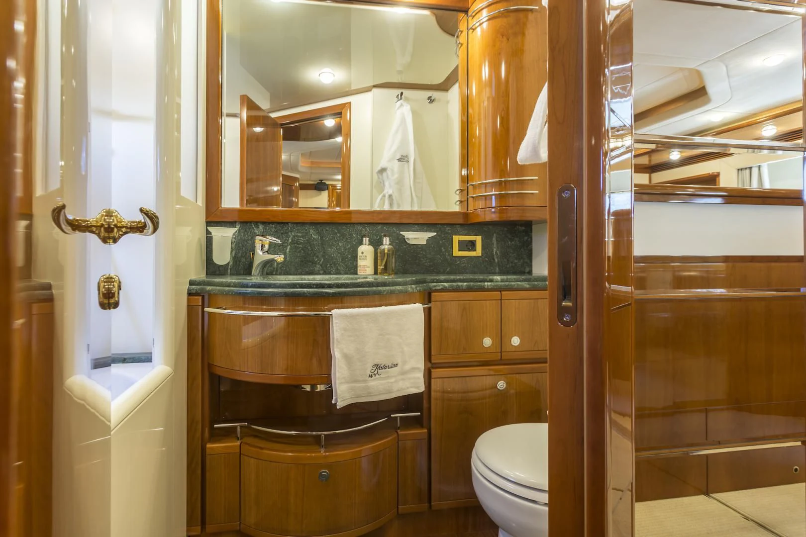 a bathroom with a large mirror aboard MISS KATARIINA Yacht for Sale