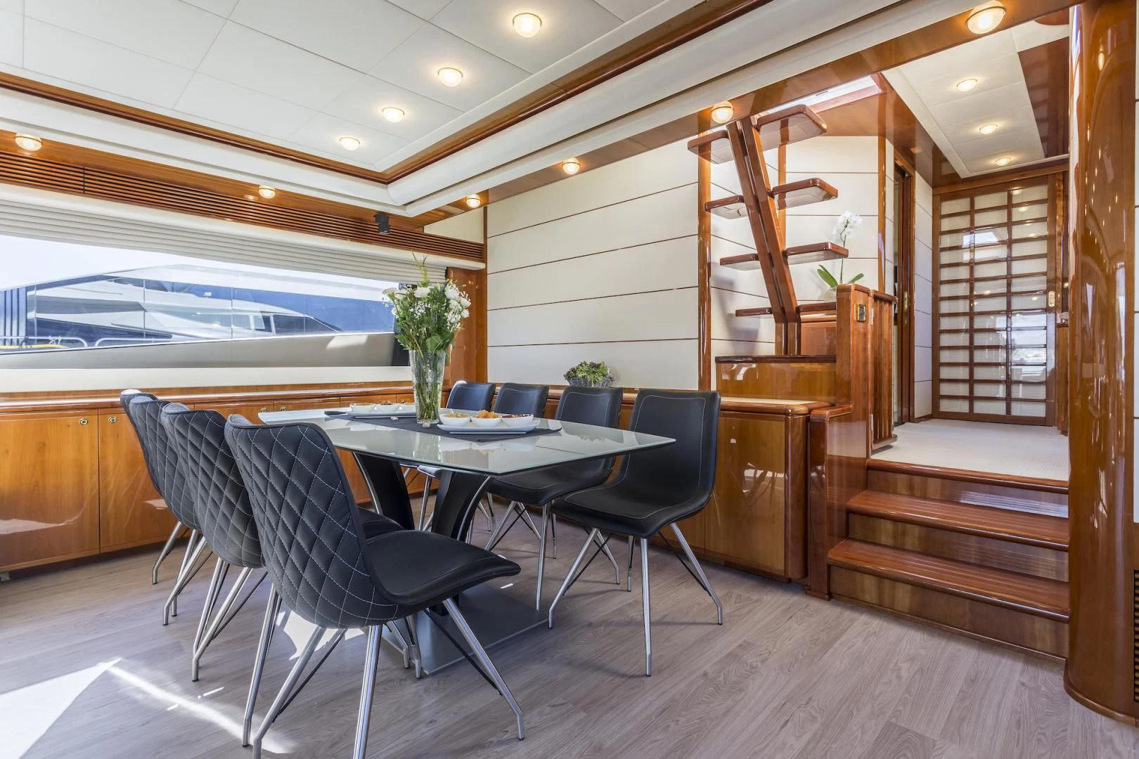 a room with a table and chairs aboard MISS KATARIINA Yacht for Sale