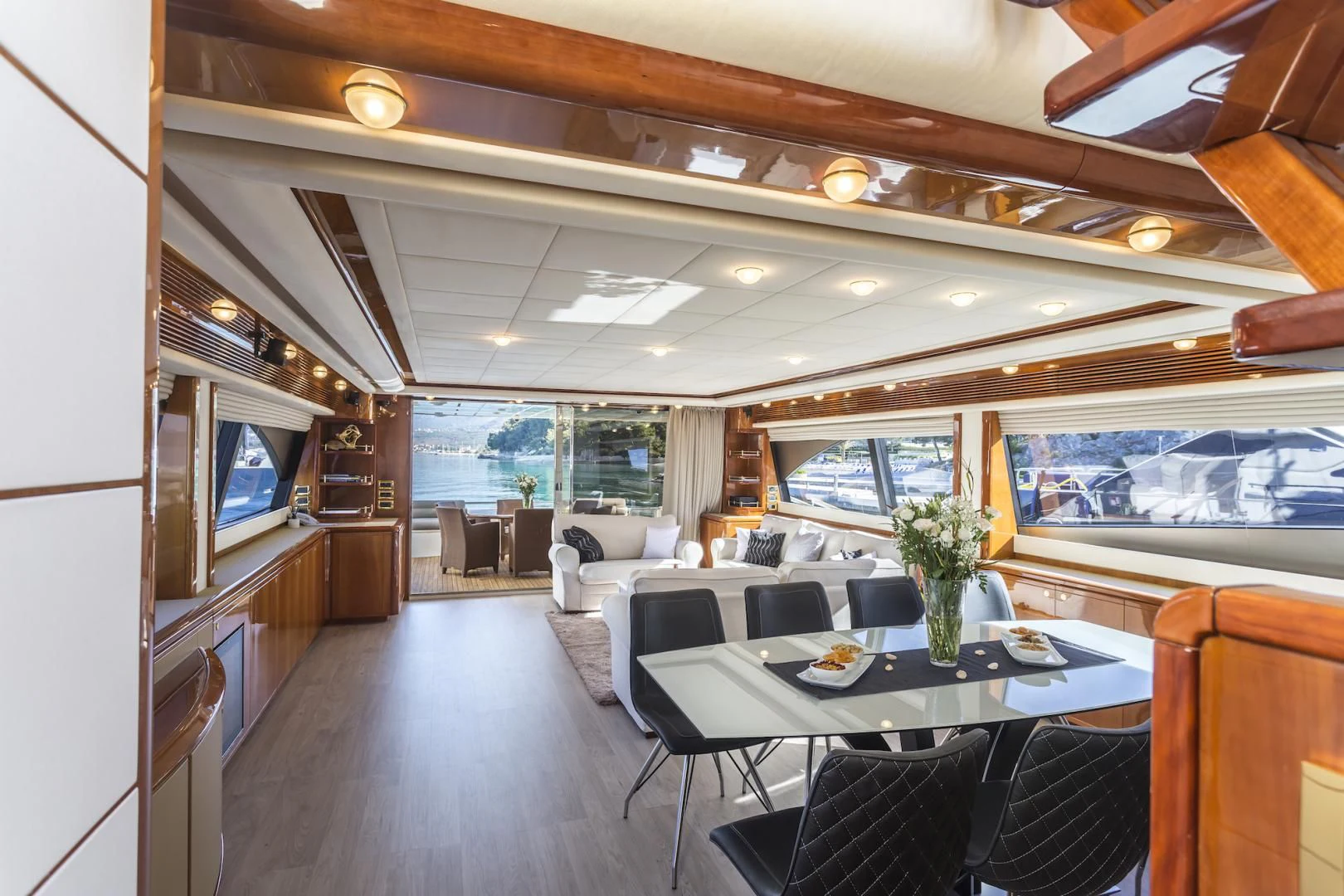 a room with a table and chairs aboard MISS KATARIINA Yacht for Sale