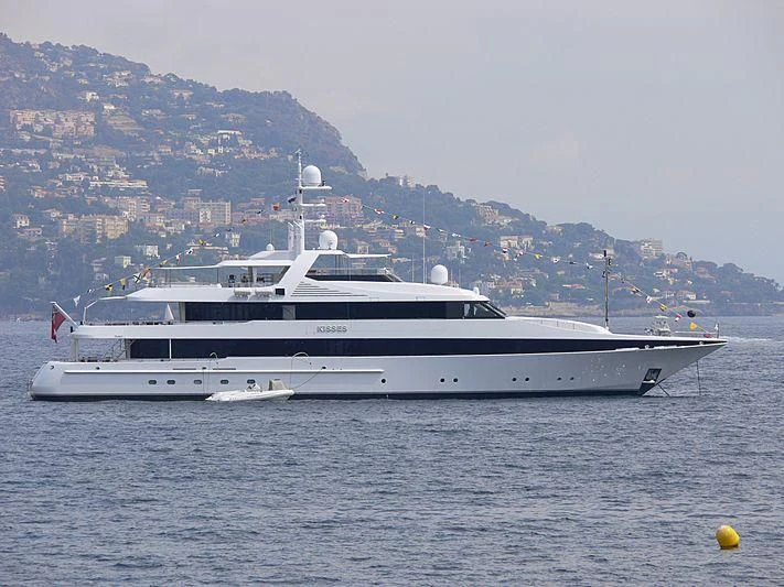 a large white yacht in the water aboard KISSES Yacht for Sale