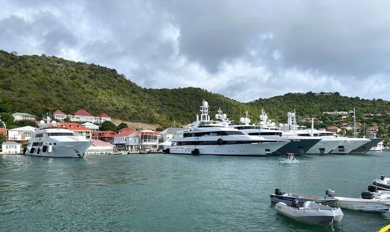 a group of boats in a harbor aboard KISSES Yacht for Sale