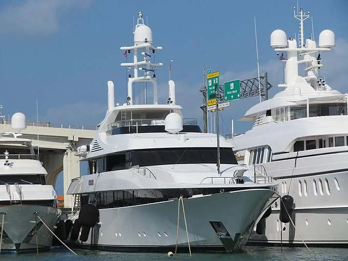 a couple of large white boats aboard KISSES Yacht for Sale