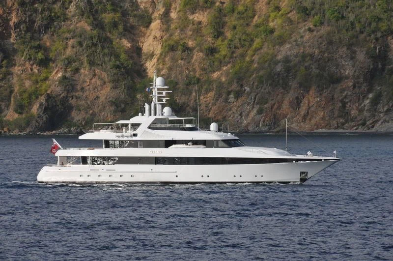 a white boat on the water aboard KISSES Yacht for Sale