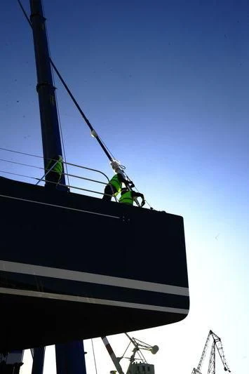 a few men working on a roof aboard DAHLAK Yacht for Sale