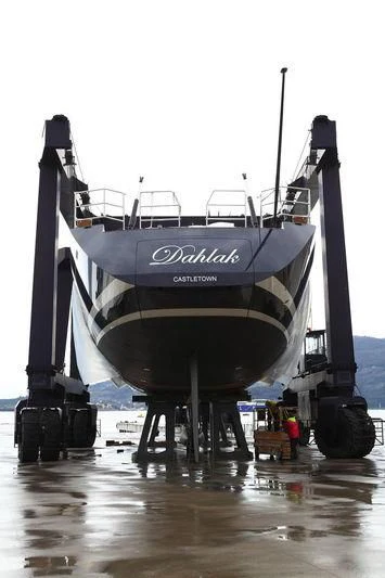 a large boat on a trailer aboard DAHLAK Yacht for Sale
