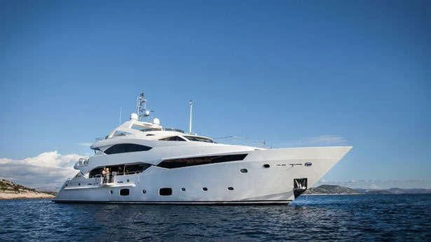a white yacht in the water aboard THE DOGS Yacht for Sale