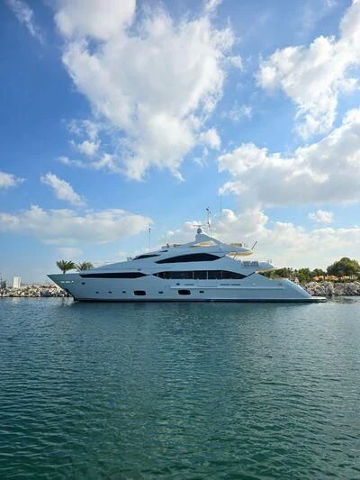 a white yacht in the water aboard THE DOGS Yacht for Sale