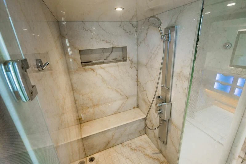 a bathroom with a shower and a tub aboard FAR NIENTE Yacht for Sale