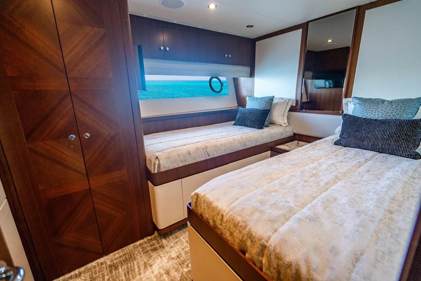 a room with a bed and a mirror aboard FAR NIENTE Yacht for Sale
