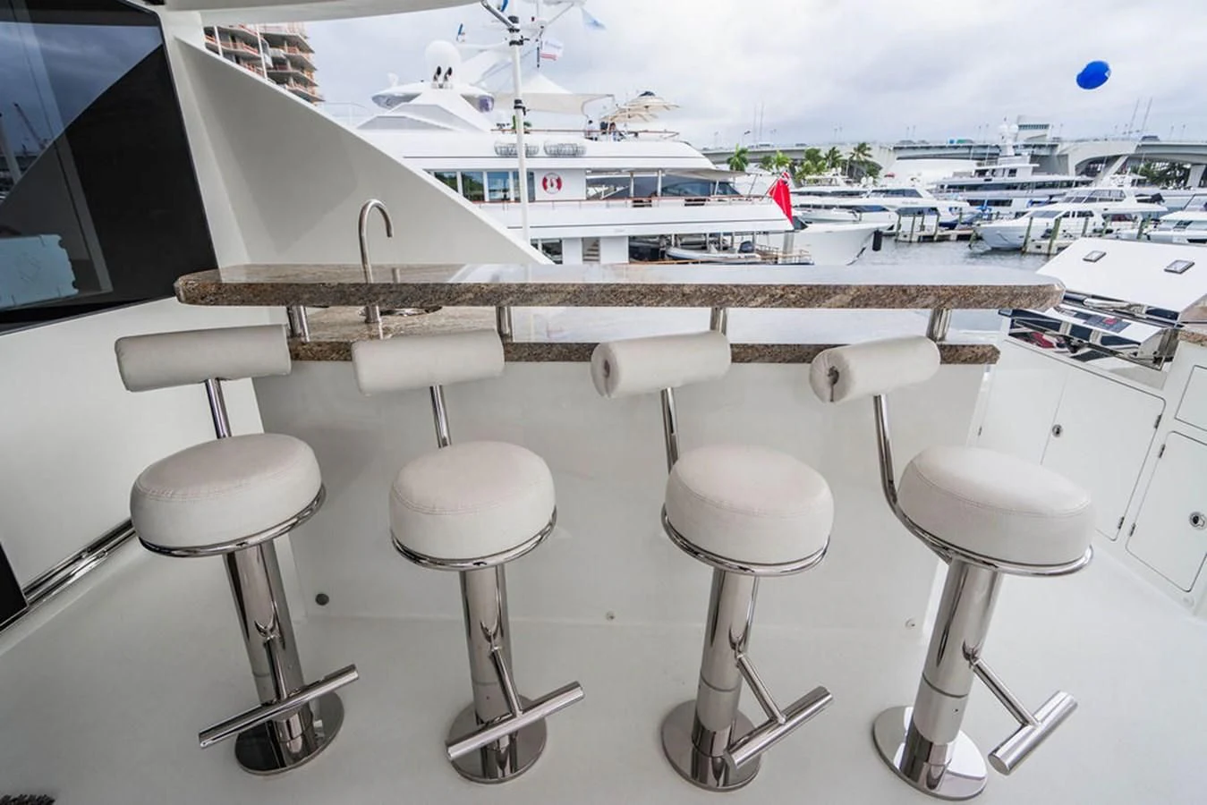 a group of stools by a plane aboard FAR NIENTE Yacht for Sale