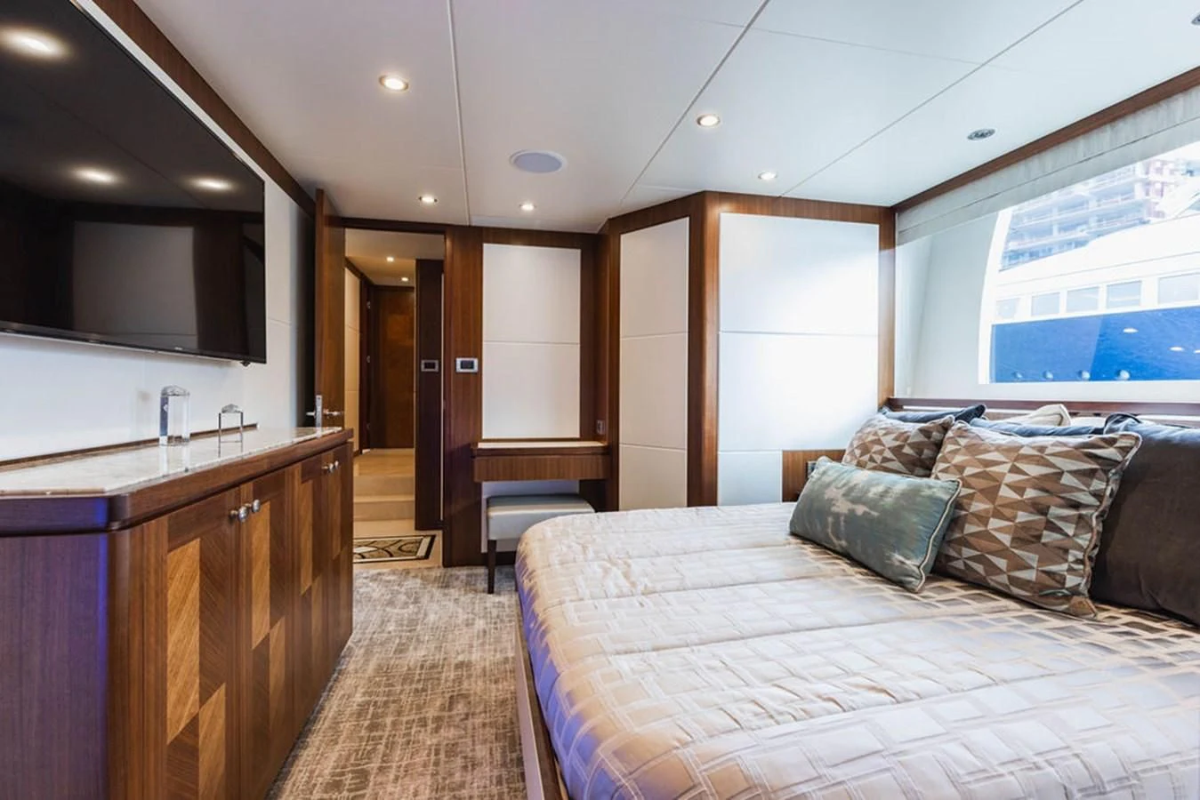 a bedroom with a large bed aboard FAR NIENTE Yacht for Sale