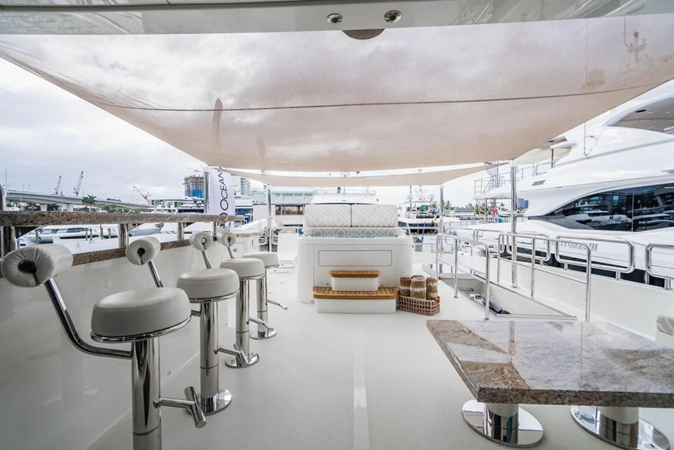 a boat with stools and tables aboard FAR NIENTE Yacht for Sale