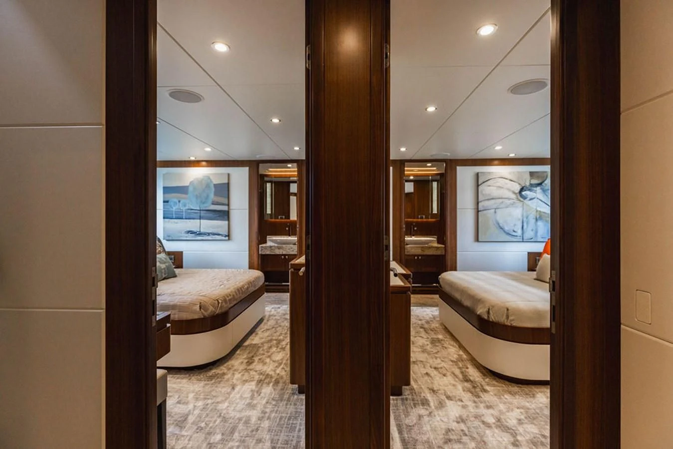 a large room with a bed and a large mirror aboard FAR NIENTE Yacht for Sale