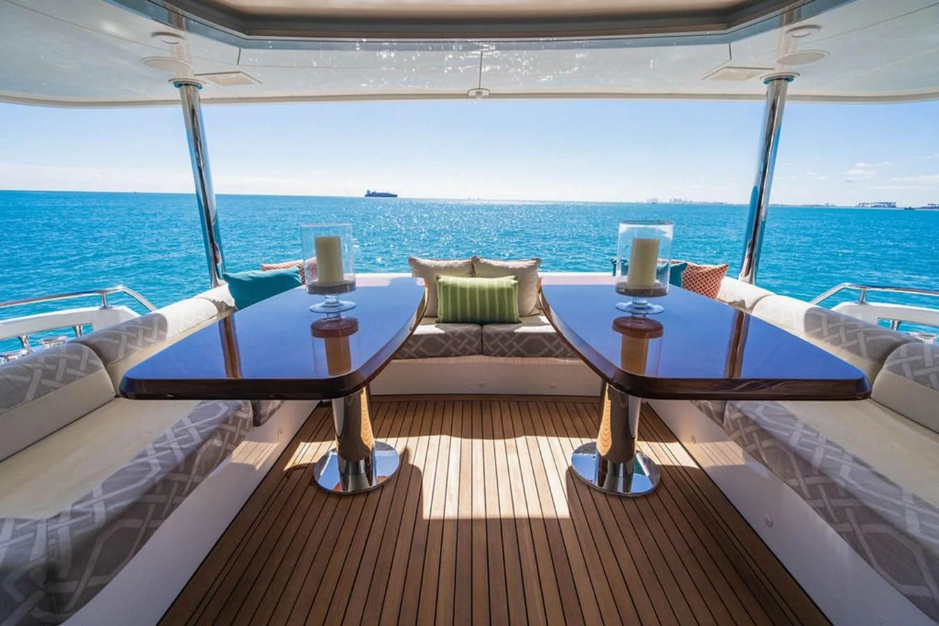 a table on a deck overlooking the ocean aboard FAR NIENTE Yacht for Sale