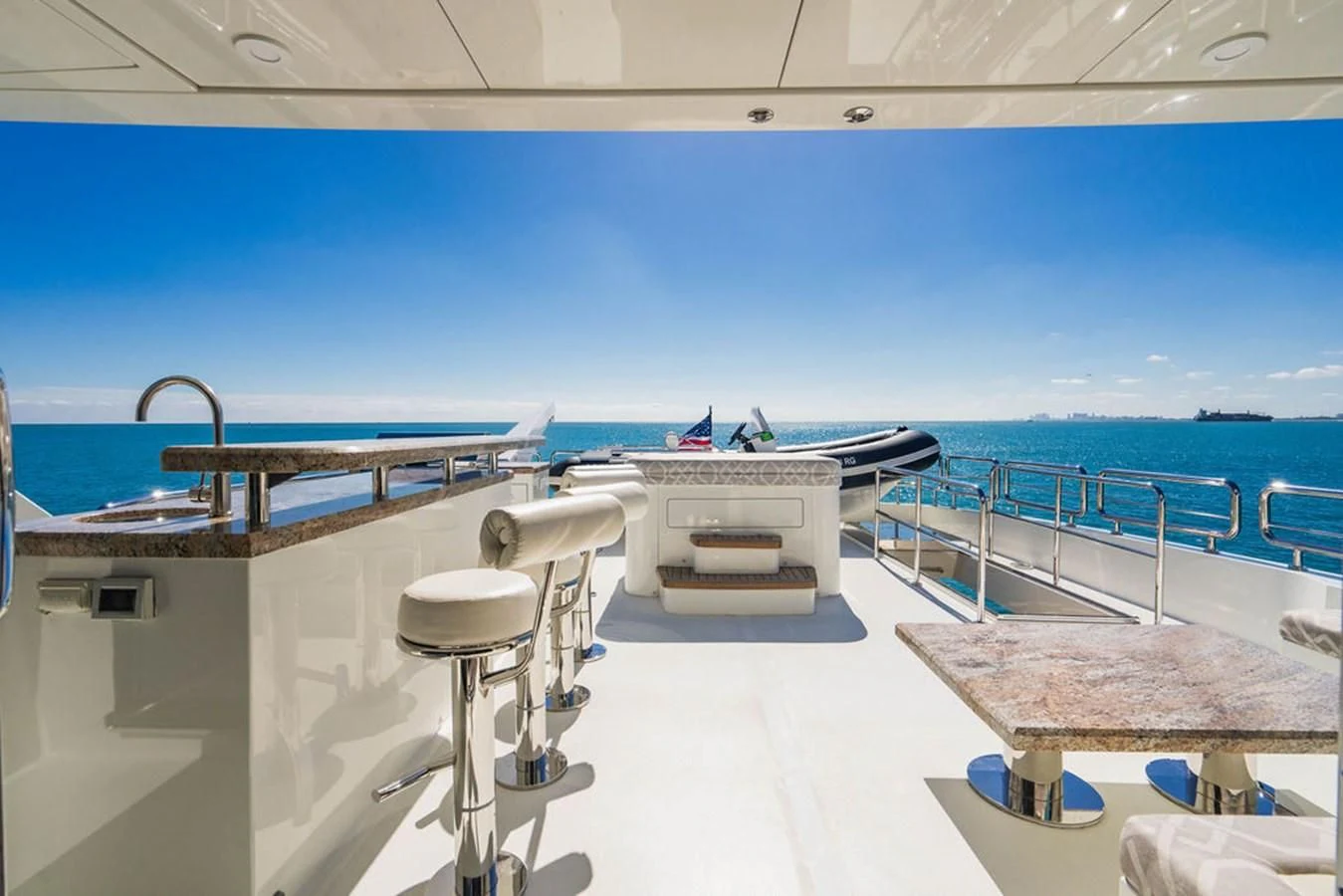 a pool with tables and chairs aboard FAR NIENTE Yacht for Sale
