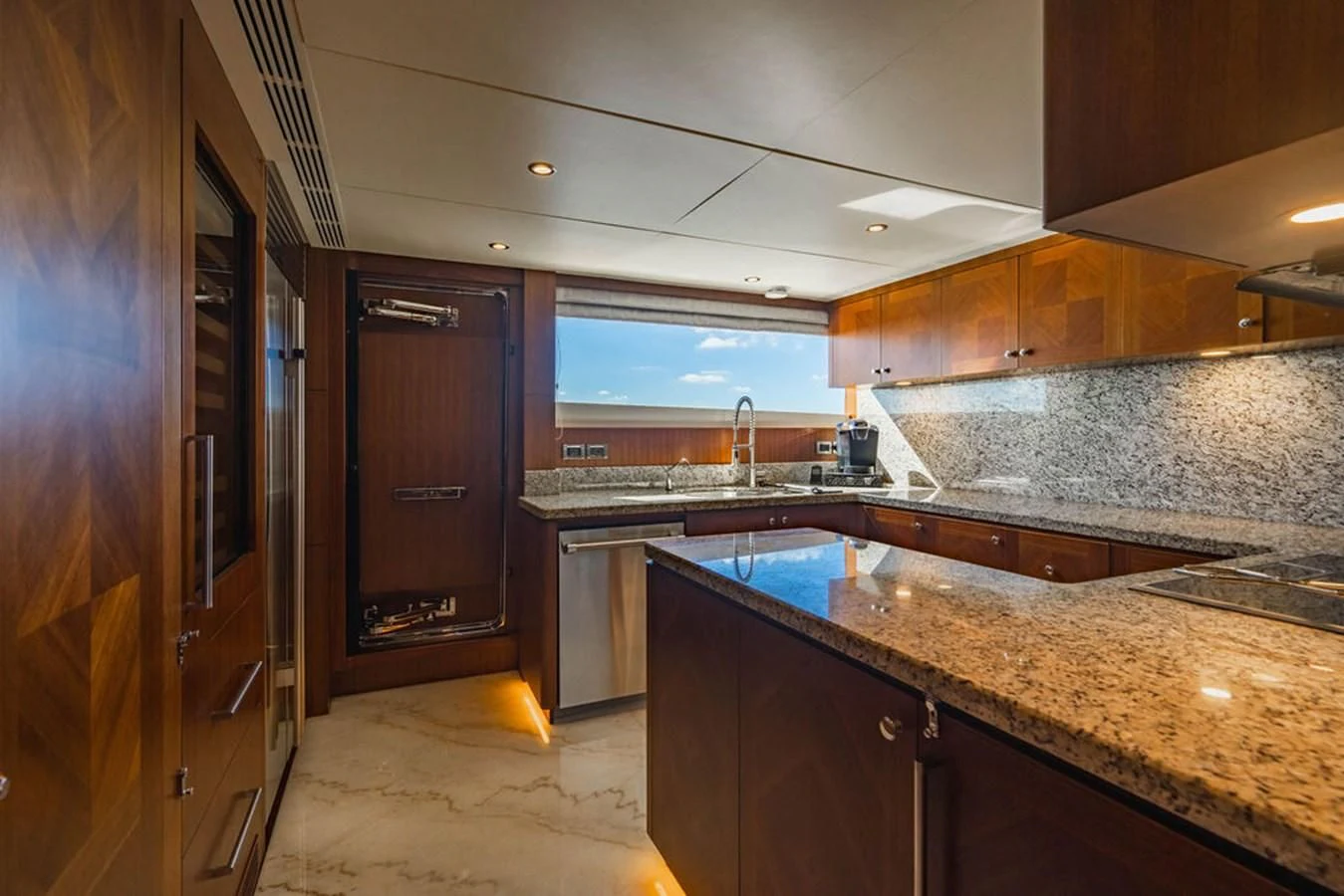a kitchen with marble counters aboard FAR NIENTE Yacht for Sale