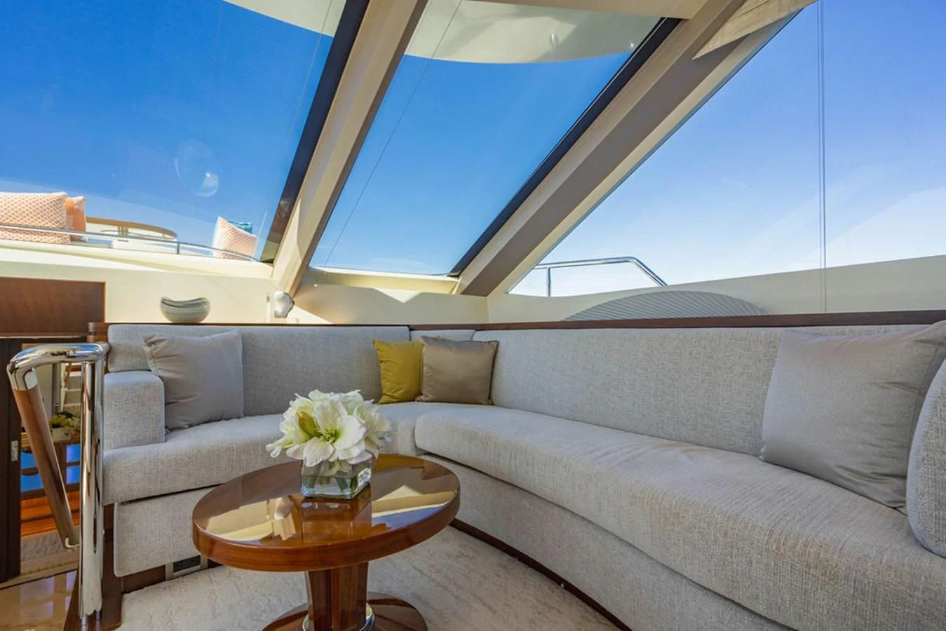 a couch with a table in front of it aboard FAR NIENTE Yacht for Sale