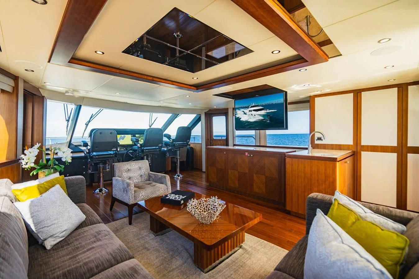 a living room with a large screen aboard FAR NIENTE Yacht for Sale