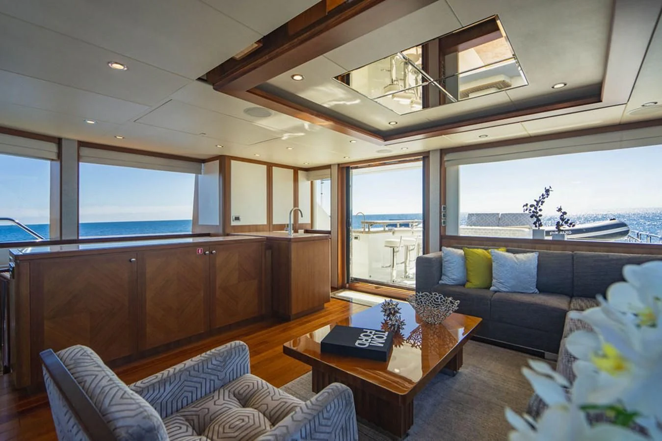 a living room with a couch and a table aboard FAR NIENTE Yacht for Sale