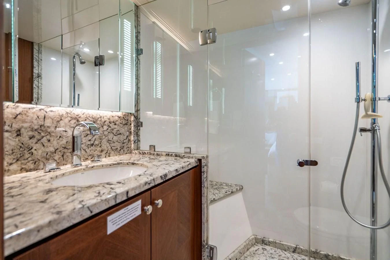 a bathroom with a sink and a shower aboard FAR NIENTE Yacht for Sale