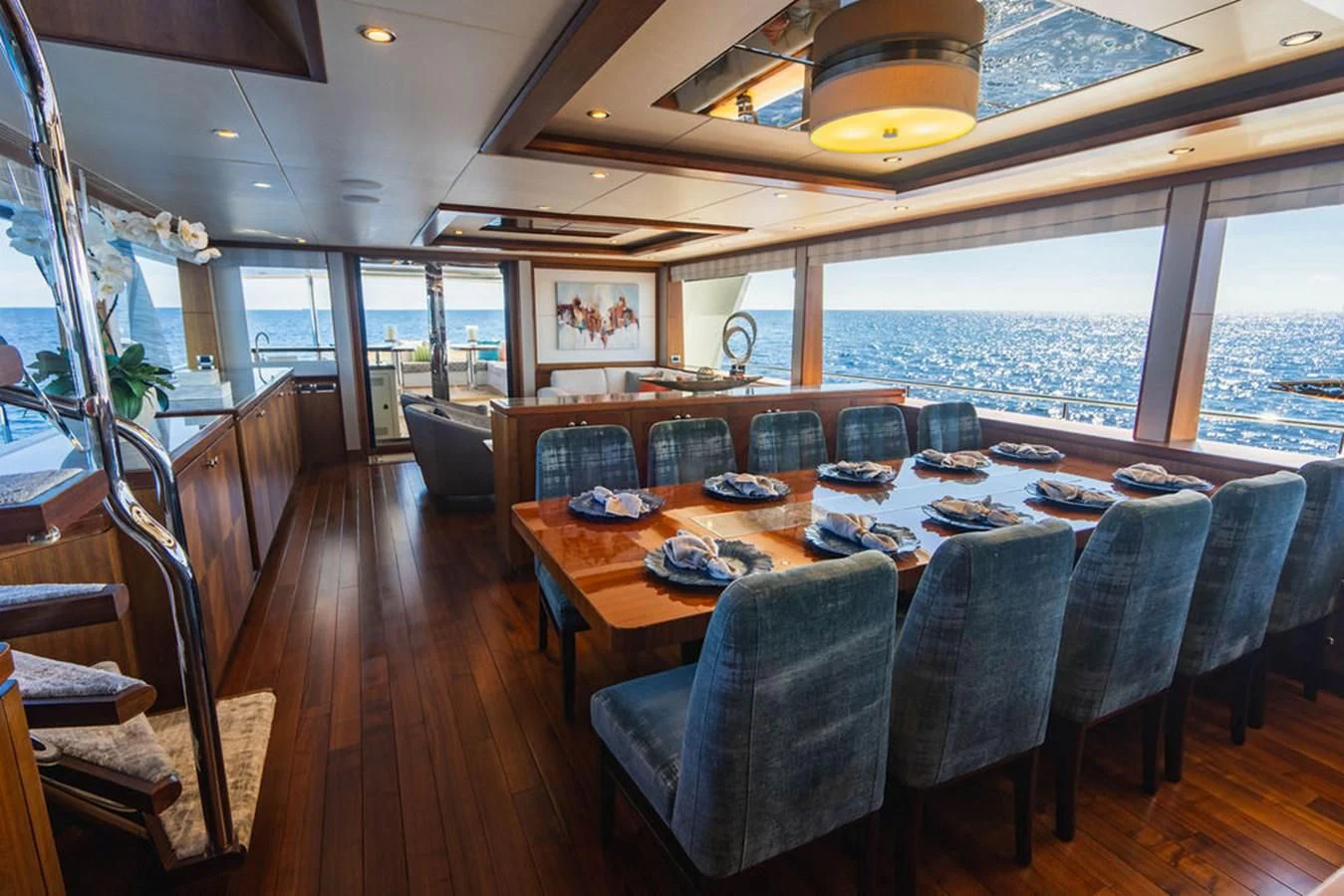 a dining table with a view of the ocean aboard FAR NIENTE Yacht for Sale