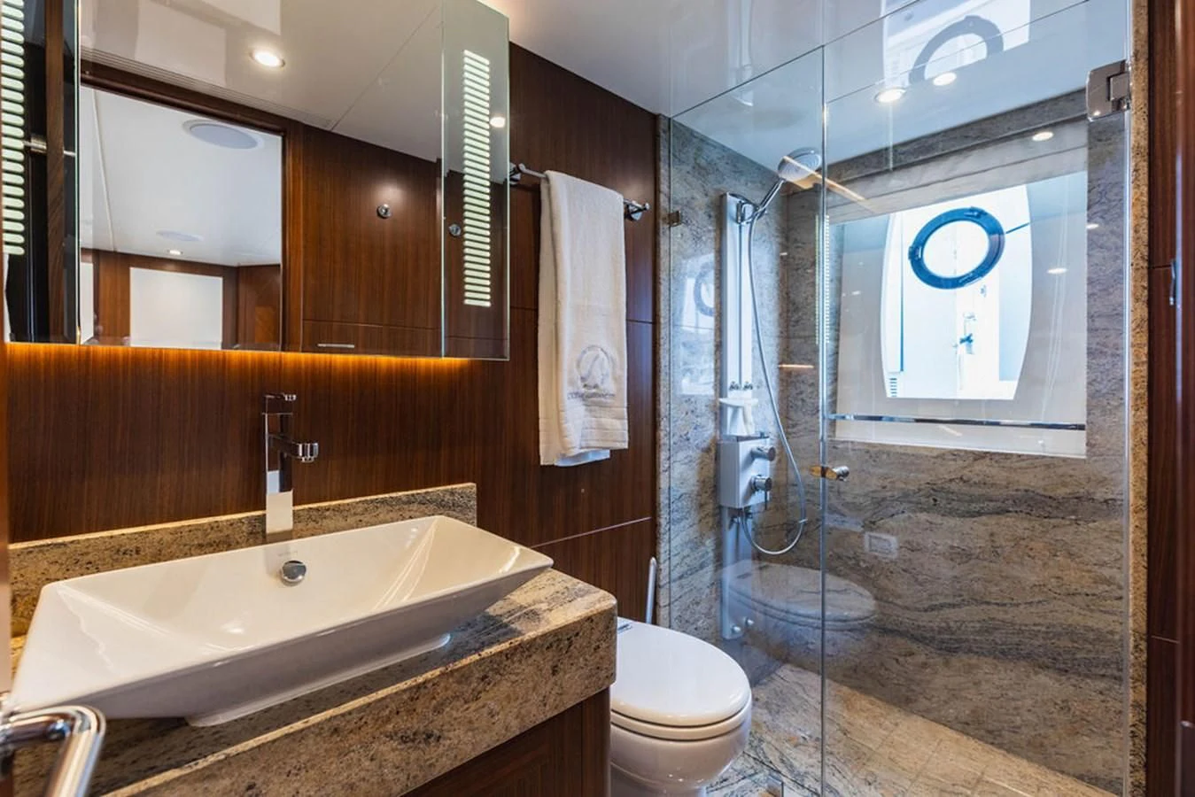 a bathroom with a glass shower aboard FAR NIENTE Yacht for Sale