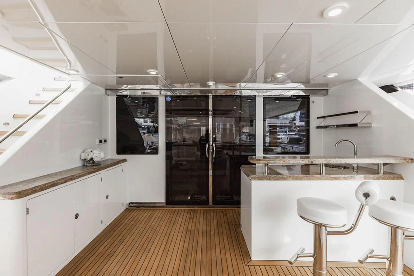 a kitchen with a large island aboard FAR NIENTE Yacht for Sale