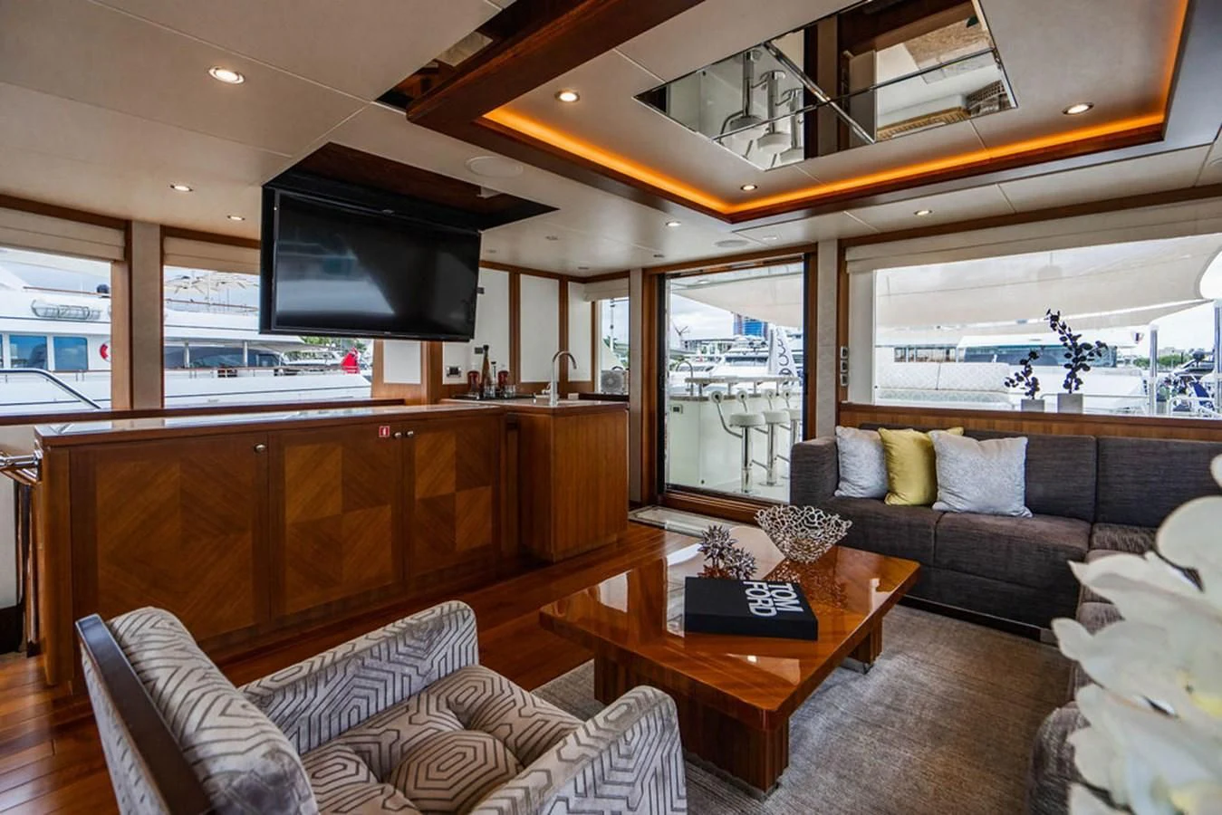 a living room with a couch and a tv aboard FAR NIENTE Yacht for Sale