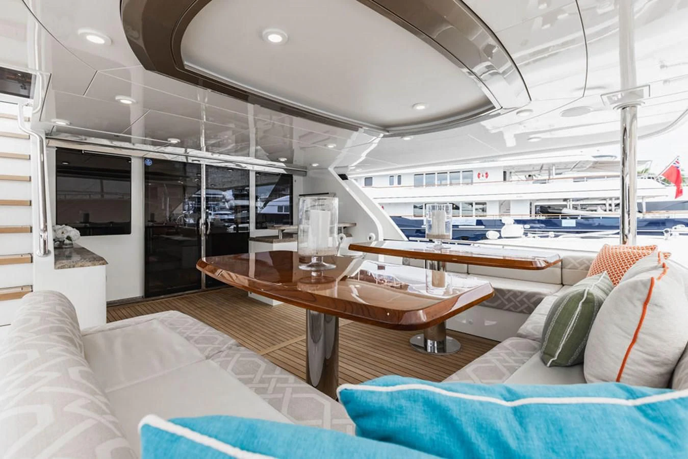 a room with a table and couches aboard FAR NIENTE Yacht for Sale