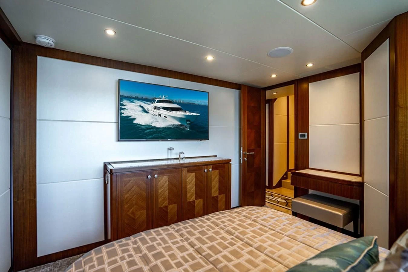 a bedroom with a large painting on the wall aboard FAR NIENTE Yacht for Sale