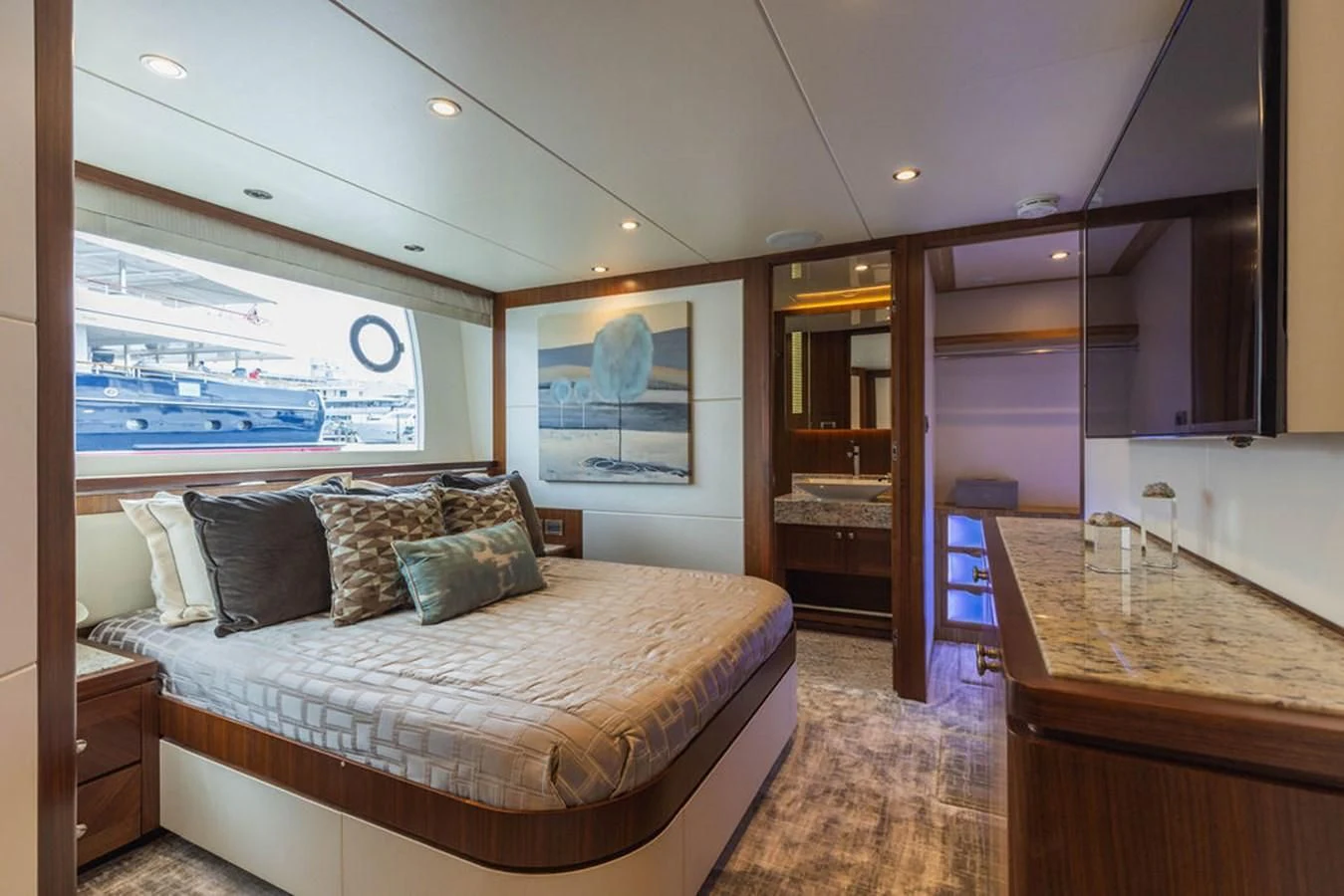 a bedroom with a large window aboard FAR NIENTE Yacht for Sale