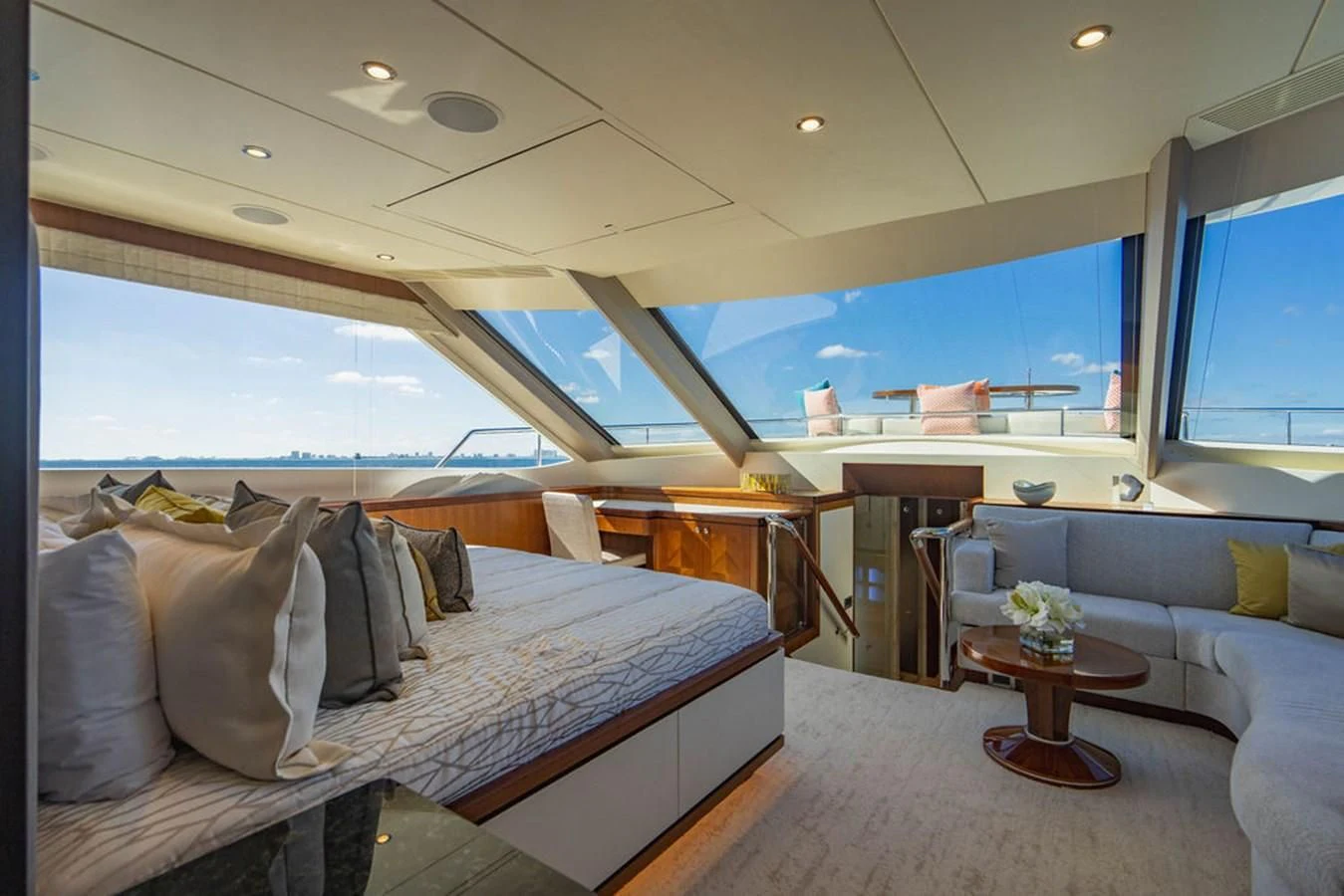a room with a bed and a table aboard FAR NIENTE Yacht for Sale