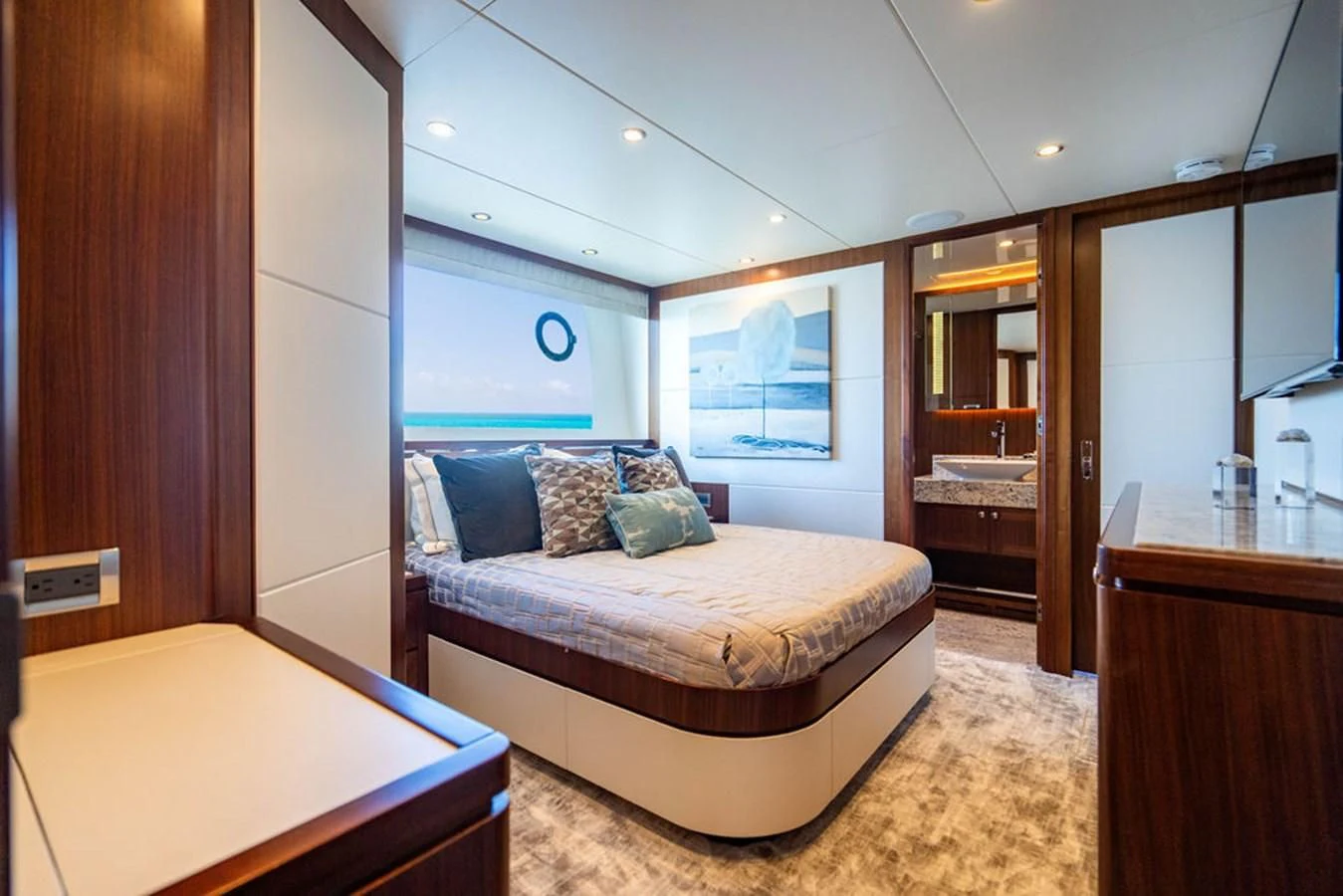 a bedroom with a bed and a desk aboard FAR NIENTE Yacht for Sale
