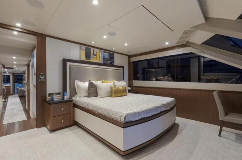 a large bedroom with a large mirror aboard FAR NIENTE Yacht for Sale