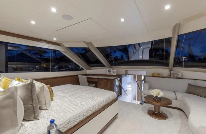 a room with a bed and a table aboard FAR NIENTE Yacht for Sale