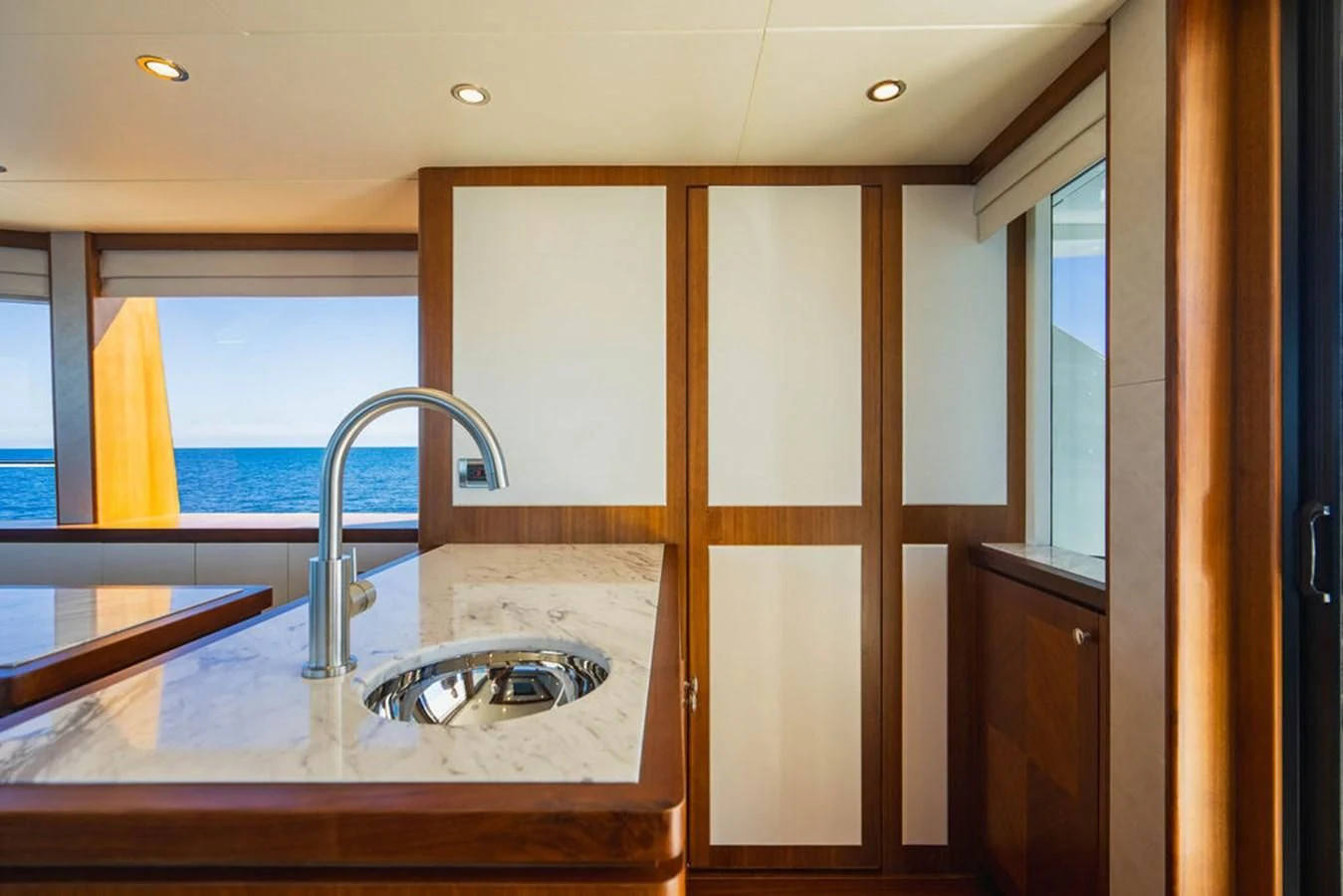 a kitchen with a sink and cabinets aboard FAR NIENTE Yacht for Sale