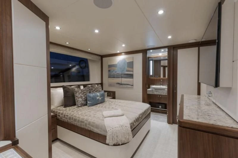 a bedroom with a large mirror aboard FAR NIENTE Yacht for Sale