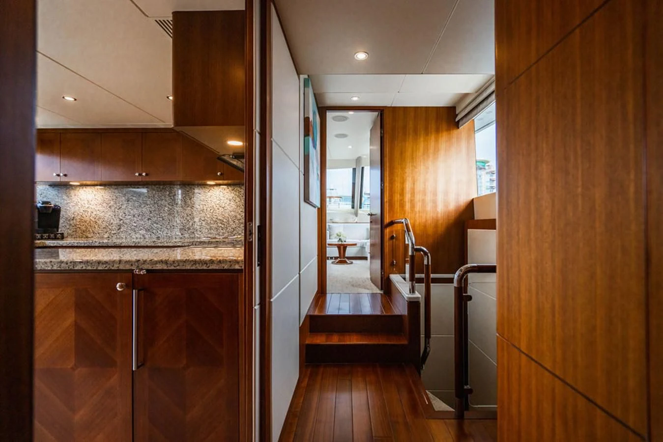 a kitchen with wooden cabinets aboard FAR NIENTE Yacht for Sale