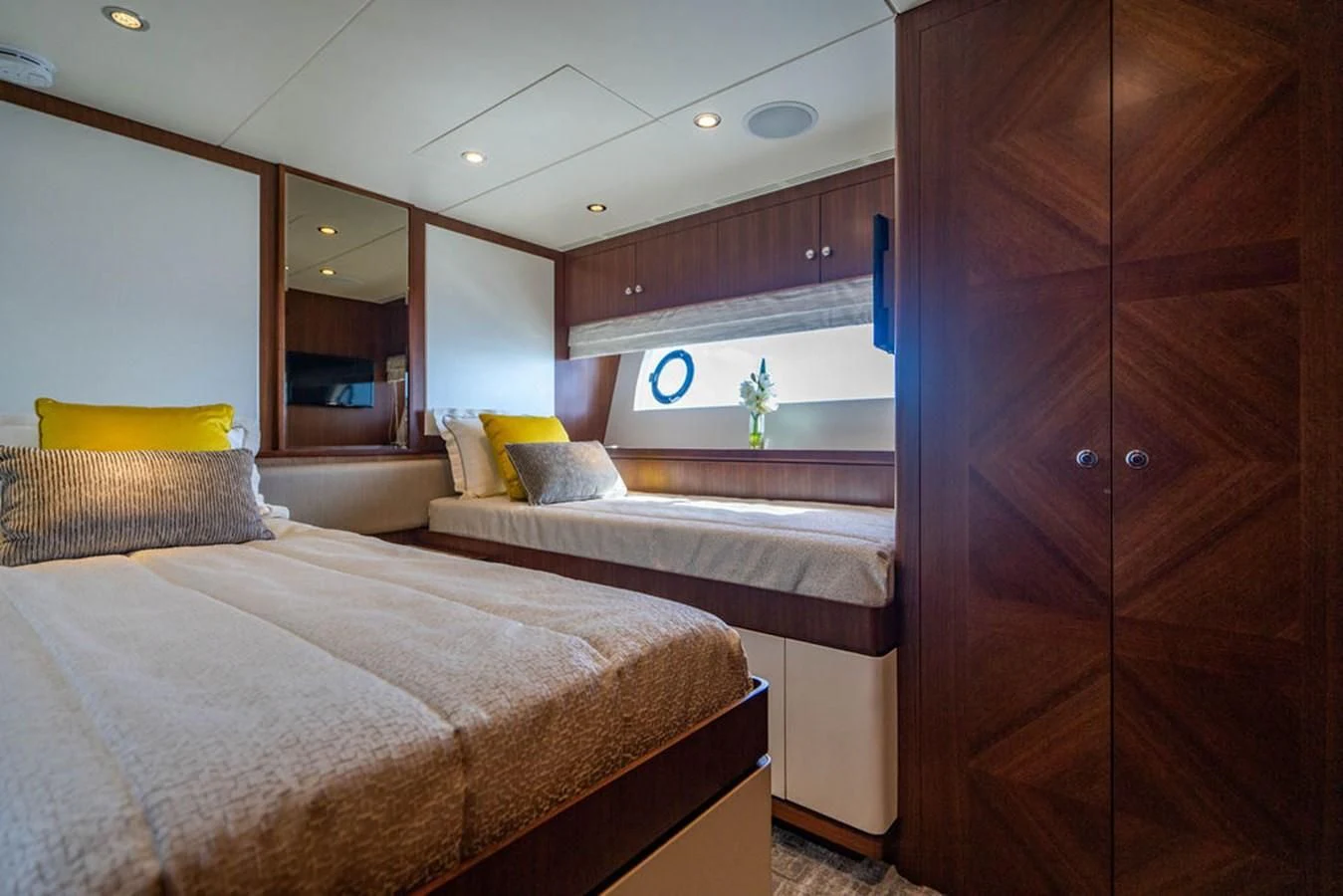 a bedroom with a bed and cabinets aboard FAR NIENTE Yacht for Sale