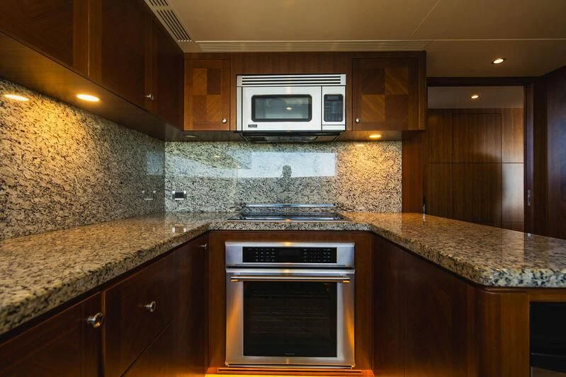 a kitchen with granite counter tops aboard FAR NIENTE Yacht for Sale